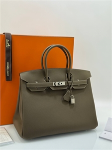 {{productViewItem.photos[photoViewList.activeNavIndex].Alt || productViewItem.photos[photoViewList.activeNavIndex].Description || 'Сумка HERMES'}}
